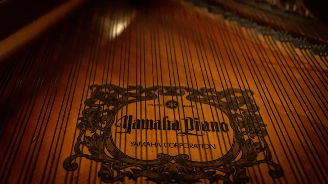 Inside a Yamaha grand, the gold harp and strings